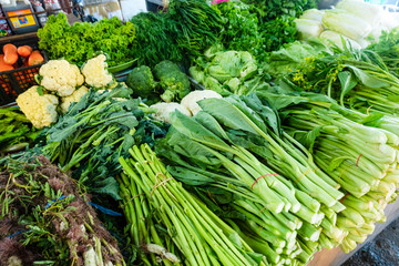 Traditional asian market. Fruits and vegetables at a farmers market. Organic fresh agricultural...