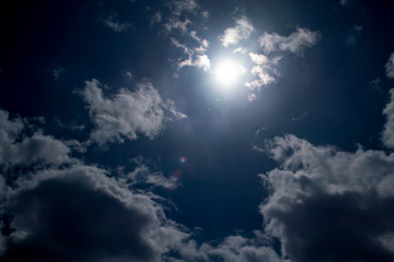Naklejka na ściany i meble blue sky with a bright sun under the filter