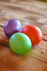 Beautiful painted eggs on wooden background.Easter.