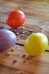 Beautiful painted eggs on wooden background.Easter.