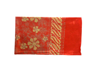 Folded floral Batik pattern tablecloth at white background. 