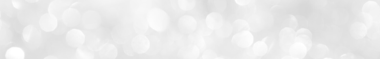 A brilliant white background with circles and ovals. Template for a holiday card with bright and sparkling lights.