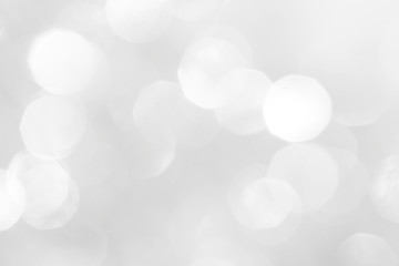 A brilliant white background with circles and ovals. Template for a holiday card with bright and sparkling lights.