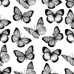 Seamless black and white pattern of butterflies on white background.	