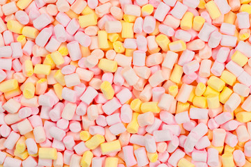 Marshmallow. Background of pink and yellow colorful mini marshmallows.