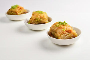Pistachio baklava on a white background. Dessert.