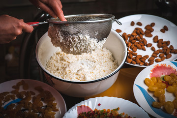 The process of making traditional Easter molded cottage cheese dessert paska.