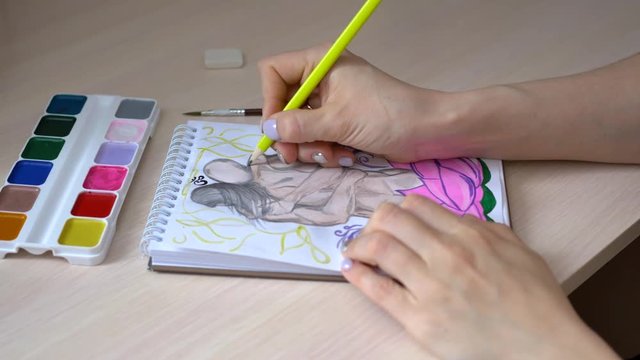 The girl draws a picture on which the guy hugs a naked girl.
