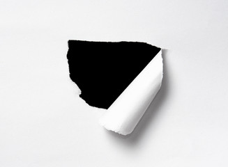 Hole in the paper with space for text with black background