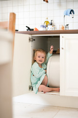 Kids playing hide and seek, blonde Toddler girl