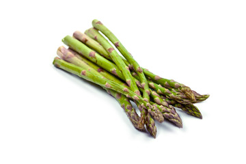 Bunch of fresh raw garden asparagus isolated on white background. Green spring vegetables.