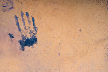door metallic rusty paint on the door and handprint paint