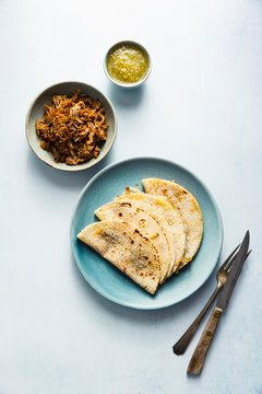 Cheese quesadillas with pork carnitas and salsa verde
