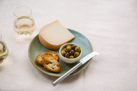 Plate Of Gouda Cheese And Olives