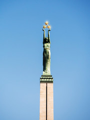 Latvian landmark, Statue of freedom, called Milda. Riga, Latvia, Three golden stars in hands of statue.