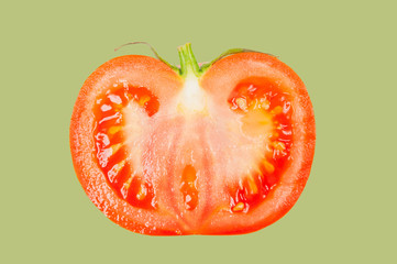 Tomato levitate in air on green pastel background.