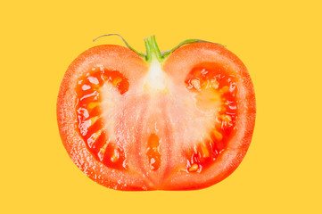 Tomato levitate in air on yellow pastel background.