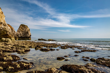 Fototapeta na wymiar Rock formations at low tide, at Freshwater Bay on the Isle of Wight