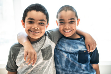 Portrait Of twin african american Brother at home