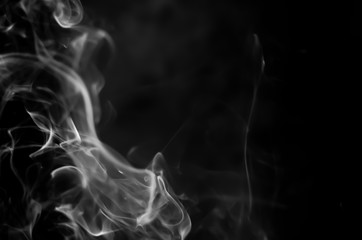 White smoke on a black background. Abstract elegant monochrome background.