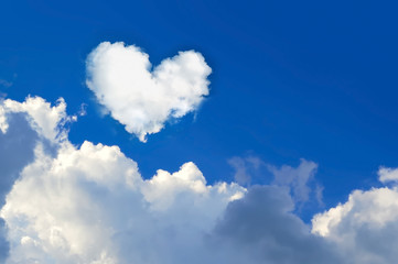Fototapeta na wymiar cloud shaped heart on blue sky. Love background 