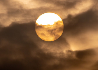 Fototapeta na wymiar Sun behind clouds