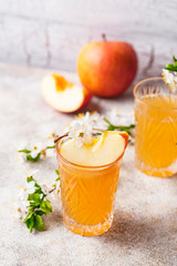 Glasses with fresh apple juice or cider
