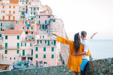 Fototapeta na wymiar Happy couple background stunning village of Manarola, Cinque Terre, Liguria, Italy