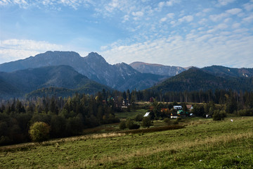 Rural landscape with mountains and houses