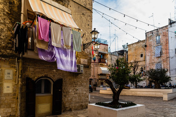 Narrow streets of the beautiful city of Bari, ideal for strolling when we tour in Italy.