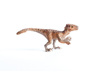 Plastic dinosaur syntarsus - toy isolated on white