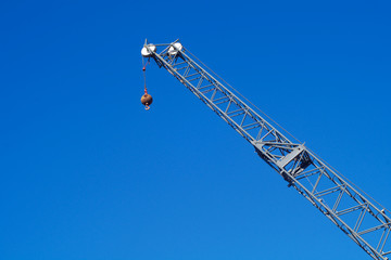 crane on blue sky hook lifting equipment construction industry