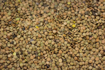 lentils health food cereals selling in supermarket, textured background from above
