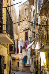 Colorful and old alleys of the touristic Italian city of Bari.