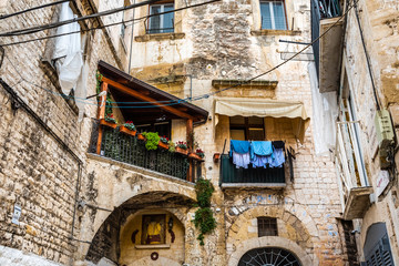 Colorful and old alleys of the touristic Italian city of Bari.