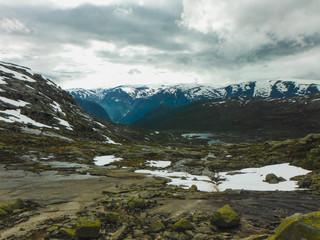Obraz premium Trolltunga hike, Lake Ringedalsvatnet, Norway, Beautiful scandinavian landscape, Scandianavia, summer nature. Hike starts from Odda town