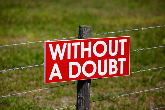 Sign on a Barbwire Fence