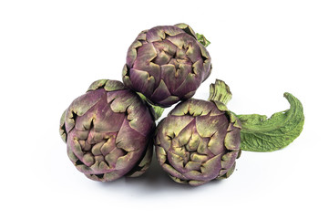 three artichokes closeup isolated withe background