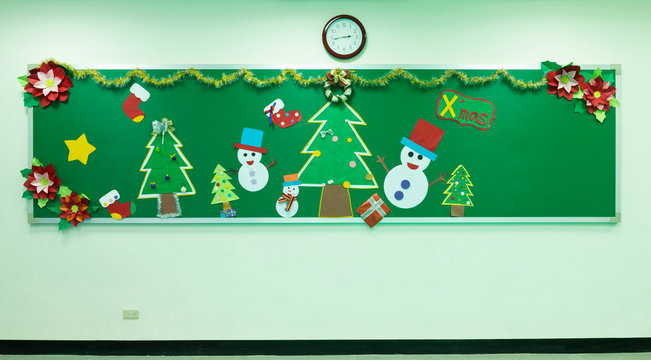 Classroom chalkboard decorated for Christmas