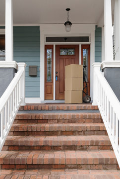 Cardboard boxes on front porch of new house