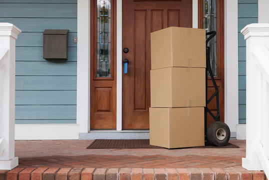 Cardboard boxes on front porch of new house