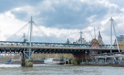 Hungerford Bridge and boats on the London River Thames