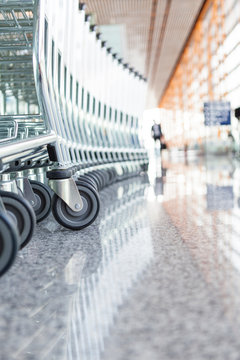 Close up of wheels of stacked airport carts