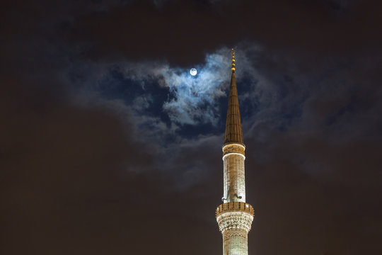 Full moon over tower of Blue Mosque at night, Istanbul, Turkey