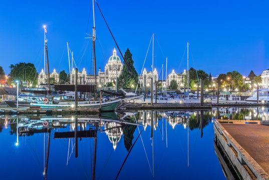 Parliament Buildings and harbor illuminated at dawn, Victoria, British Columbia, Canada