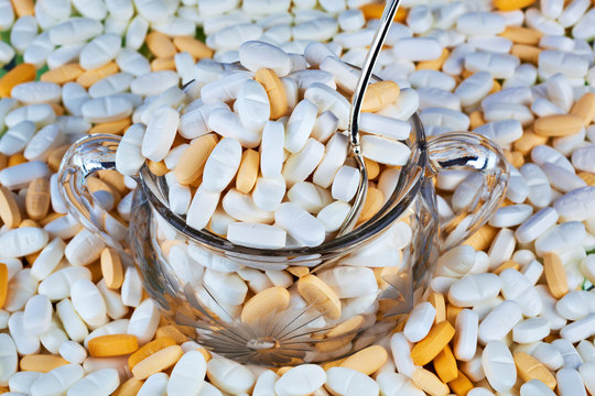 Prescription medication overflowing from sugar bowl