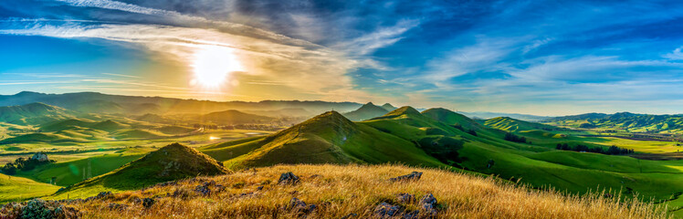 Panorama of Hills of Grass at Sunrise