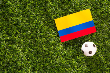 Soccer of Colombia, flag and ball on grass.
