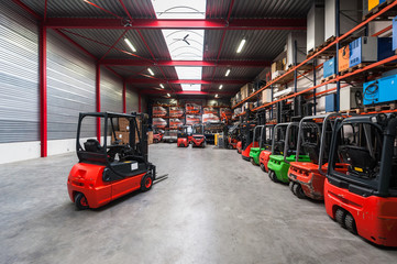 Forklift machinery working in warehouse