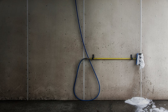Foaming brush with hose in car wash